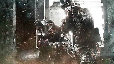 Two heavily armed masked paintball soldier on post apocalyptic background. Loop hd video for paint ball.