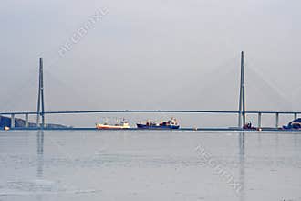 Vladivostok, Russia, January, 29,2019. The bridge to the island Russkiy and the ships under it in the winter