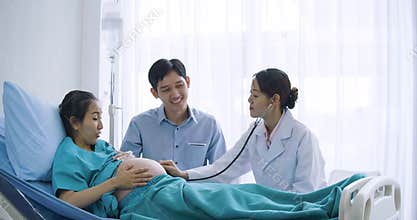 Doctor use stethoscope to examine pregnancy woman