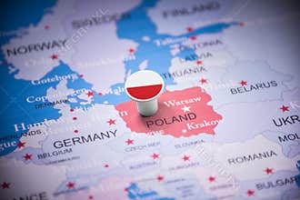Poland marked with a flag on the map