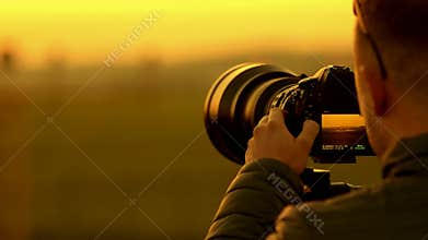 Men taking pictures of airplanes at the airport