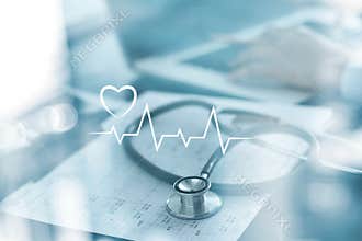 Stethoscope with heart beat report and doctor analyzing checkup on laptop in health medical laboratory