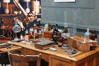 Old science lab with chemical reagents and burner
