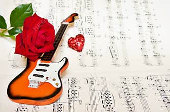 Love song with guitar and rose