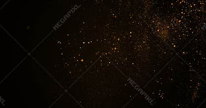 Christmas golden gradient sparkle glitter explosion dust particles background with bokeh flowing falling down in slow motion,