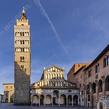 The wake of an airplane above the Duomo of Pistoia, Tuscany, Italy
