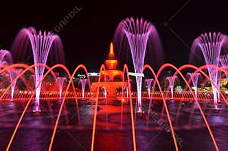 Light and water night show. Pink and red color. Bucharest, Romania