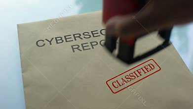 Cybersecurity report classified, stamping seal on folder with important document