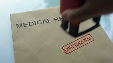 Medical records confidential, stamping seal on folder with important documents