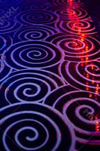 Club dance floor interior. spiral tile background whith bokeh reflection