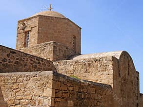 close up of the ancient church of Ayia Kyriaki Chrysopolitissa in paphos cyprus showing the basilica shaped structure and tower