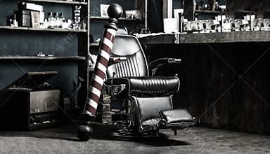 Logo of the barbershop, symbol. Stylish vintage barber chair. Hairstylist in barbershop interior. Barber shop chair
