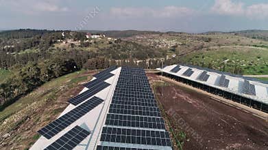 Aerial footage over chicken farm covered with solar panels in northern Israel