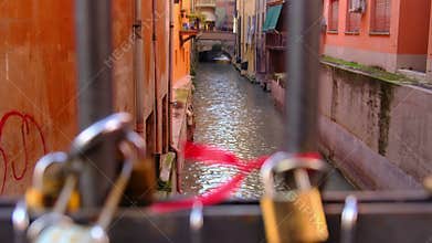 Love padlocks in Bologna canal bridge - Italy
