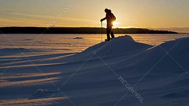 A Sunset Snowshoe hike on a Frozen Lake