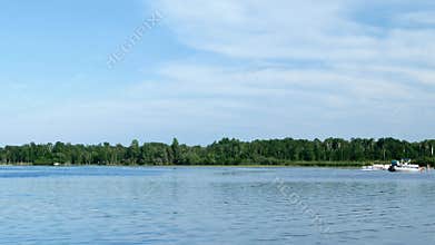 Families swimming, boating and enjoying life on a beautiful Minnesota lake.