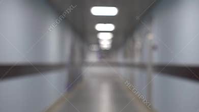 Long blurred corridor, modern building interiors. Office corridor concept.