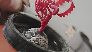 Closeup. Creating wax molds for production of jewelry. Goldsmith in work. Soldering tool for melt waxy. Creation