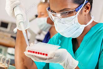 Asian Female Scientist Blood Test Medical Research Lab