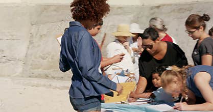 Side view of diverse volunteers preparing for beach cleanup on the beach 4k