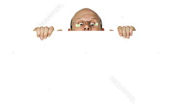 Curious man looking over white wallsign.