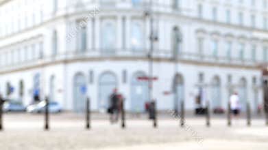 Blurred view of an Old Town in Europe, classic architecture and people walking on the street