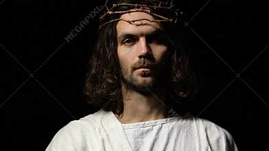 Jesus in crown of thorns reaching out helping hand, saving sinner, religion