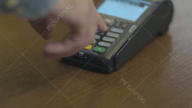 Closeup shot of customer pay over the wireless tradings card-reader. Adult human hands of businessman use bankcard