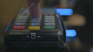 Closeup shot of customer pay over the wireless tradings card-reader. Adult human hands of businessman use bankcard