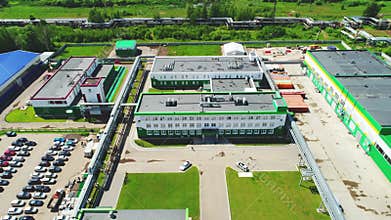 Plant main office with lawns and parking area aerial view