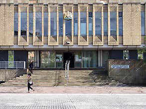 pedestrians walk past the front of bradford magistrates court in west yorkshire in centenary square