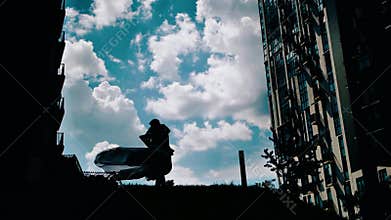 A beautiful couple of lovers are dancing on the background of clouds. beautiful sky. beautiful architecture. good mood. love.