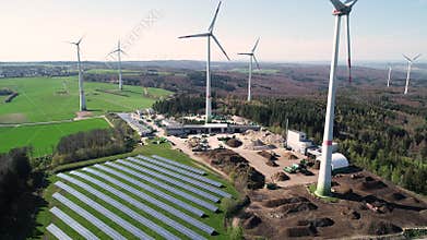 Wind turbine park and solar collectors - aerial view