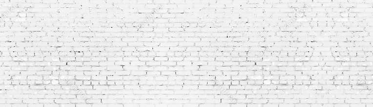 Whitewashed shabby brick wall wide panoramic texture. White painted aged brickwork panorama. Long light background