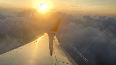 View from inside cafe to the sidewalk outside of people hurrying with umbrellas
