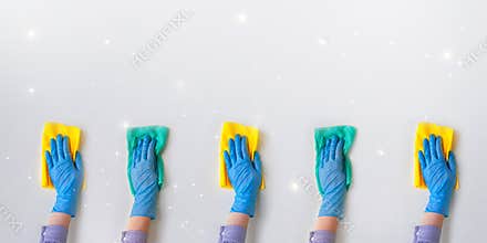 Commercial cleaning company. Employee hands in blue rubber protective glove. General or regular cleanup