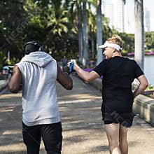 People jogging at park together