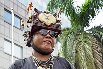 A man with extraordinary headdress.