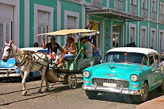 People traveling in a horse carriage in Cuba