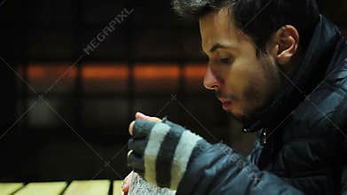 Hungry poor man eating salad with cheese and vegetables. Charity event. Pleasure