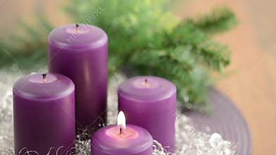 Lit purple Candles. Christmas Decoration.
