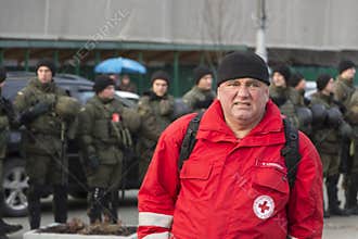 Kyiv, Ukraine, Independence Square, September 9: The Volunteer of the Red Cross stands near the building of the National