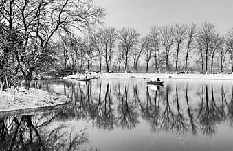 Black and white winter snow landscape of Xuanwu Lake with tree reflections,Nanjing