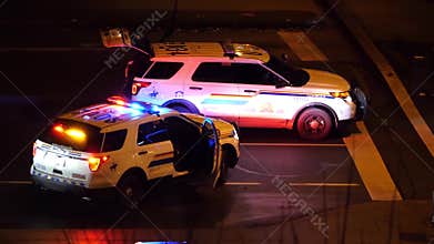 Aerial view of red and blue emergency lights of police cars