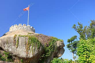 Blockhouse and chinese flag on the rock, srgb image