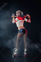 Cosplayer girl with in Harley Quinn costume. Halloween make up