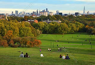 London, UK - AUGUST 13, 2017: People resting on Primrose Hill at sunset, London, UK