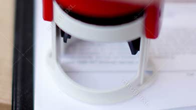 Close-up of stamping in the contract or document. UltraHD video