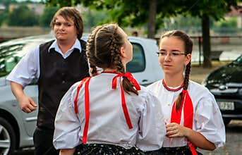 Two talking girls who go folk dancing.