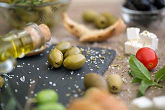 Antioxidant healthy green olives in black plate